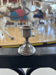 Vintage souvenir candlestick from the carousel at Euclid Beach Park. Small, but functional in theory. (From my personal collection)