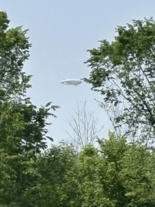 One of the Goodyear blimps was briefly visible nearby on Saturday following the recent 100th anniversary celebration for the blimps