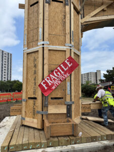 The arch was lovingly decorated with a "Fragile: Handle With Care" banner during its relocation.