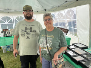 My mom and me with my display at the Amusement Preservation Museum's 2025 Open House